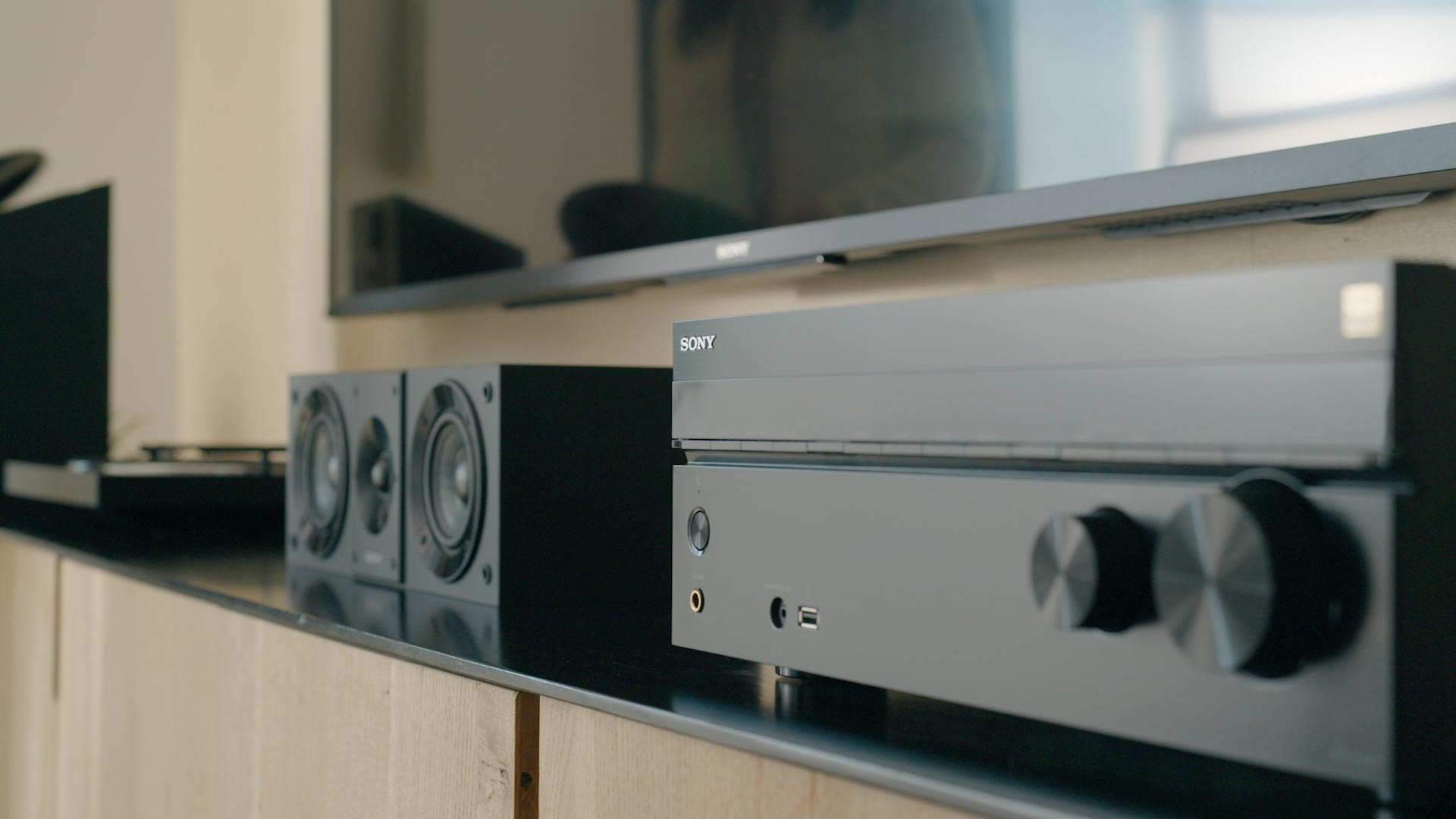 Home entertainment setup with Sony receiver and speakers